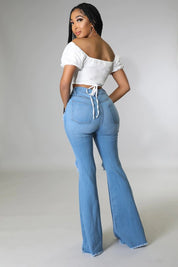 Women's High Rise Flare Jeans with Knee Rips in Medium Wash